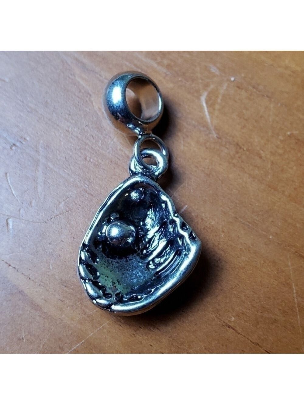 NWOT charm, silver colored half clam shell with silver pearl